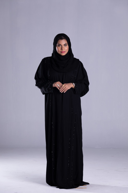Women's Simple an New Model Abaya with Korean Black Fabric and some beads to enhance its beauty. AB1028
